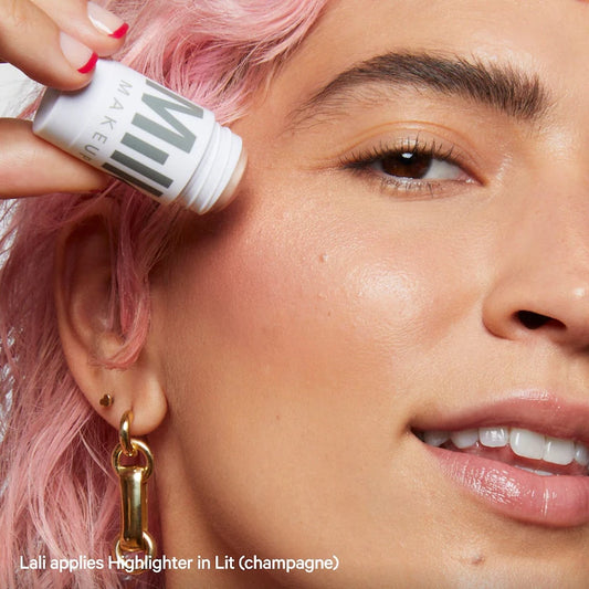 Pre orden - MILK MAKEUP 
Dewy Cream Highlighter Stick in Lit - champagne pearl